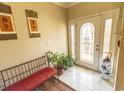Inviting entryway with decorative door and a comfortable seating area at 323 Stone Throw Dr., Murrells Inlet, SC 29576