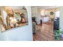 Cozy living room featuring hardwood floors and an open view to the kitchen at 323 Stone Throw Dr., Murrells Inlet, SC 29576