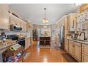 Open-concept kitchen with stainless steel appliances, center island, and ample cabinet space at 3618 Highway 430, Nichols, SC 29581