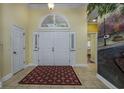 Bright foyer features tile flooring, an arched transom window and a decorative wall mural at 3901 Bay Pines Ct., North Myrtle Beach, SC 29582