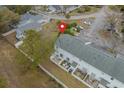 Aerial view showcasing a townhome complex with fenced patios and mature trees in a residential neighborhood at 4115 Little River Rd. # 7F, Myrtle Beach, SC 29577