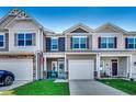 Attractive townhomes with individual garages, cozy porches, and manicured lawns at 4123 Mclamb Ave. # 4123, Little River, SC 29566