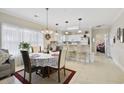 Bright dining area adjacent to the kitchen, perfect for casual meals and entertaining at 4142 Hibiscus Dr. # 104, Little River, SC 29566