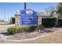Community sign for Rivergate Whispering Woods, highlighting its Waterway Community location at 4243 Rivergate Ln., Little River, SC 29566