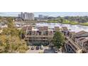 Condo building's rear exterior shows a parking lot, golf course, water feature, and buildings in the distance at 501 Maison Dr. # F-1, Myrtle Beach, SC 29572