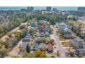 Aerial view of neighborhood showcasing proximity to the beach and a nearby pond at 508-B Rosemary Ln., North Myrtle Beach, SC 29582