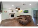 Cozy living room featuring a fireplace, wood floors, and comfortable seating at 508-B Rosemary Ln., North Myrtle Beach, SC 29582