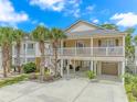 Beautiful coastal home on stilts with double porches, garage and plenty of parking at 511 N 21St Ave. N, North Myrtle Beach, SC 29582
