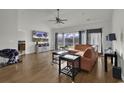 Bright living room featuring vaulted ceilings, wood floors, and large windows at 621 Cottontail Trail, Myrtle Beach, SC 29588