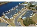 Stunning aerial view of waterfront townhomes, each with its own private boat dock, offering serene coastal living at 622 Lorenzo Dr. # 622, North Myrtle Beach, SC 29582