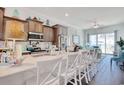 Beautiful kitchen island with marble countertops, seating and open concept living space at 622 Lorenzo Dr. # 622, North Myrtle Beach, SC 29582