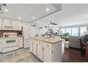 Bright kitchen and living room with island and ocean views, ideal for entertaining at 1210 N Waccamaw Dr. # 1105, Murrells Inlet, SC 29576