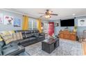 Inviting living room featuring plush seating, a vibrant red door, and a cozy atmosphere for relaxation at 1888 Singing Pines Dr., Conway, SC 29527