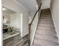 Inviting hallway features hardwood floors, stairs, and an open doorway to a room with a desk at 206 Portofino Dr., Myrtle Beach, SC 29579