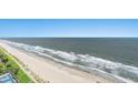 Expansive aerial shot of the beach and ocean, showing the coastline and gentle waves at 2201 S Ocean Blvd. # 1806, Myrtle Beach, SC 29577