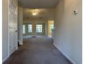 Spacious living room with neutral carpeting, ceiling fan, and good natural light at 280 Barclay Dr., Myrtle Beach, SC 29579