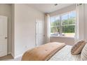Bright bedroom with a comfortable bed, a large window offering serene outdoor views at 2840 Riverboat Way, Conway, SC 29526