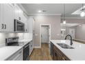 Bright kitchen featuring quartz countertops, stainless steel appliances, and ample cabinet space at 3325 Hughes Gasque Rd., Aynor, SC 29511