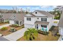 Two story home with manicured lawn, landscaping and a private driveway at 4251 Pecan St., Little River, SC 29566