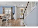 Light foyer with staircase and light wood floors at 4251 Pecan St., Little River, SC 29566