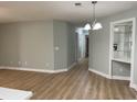 Open living area with wood-look floors, neutral paint, and dining area at 4390 Daphne Ln. # D, Murrells Inlet, SC 29576