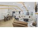 Open concept living space with exposed beams, dining area, and eat-in kitchen at 5368 Ocean Village Dr., Myrtle Beach, SC 29577