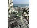 Balcony view with chairs and beach overlooking the ocean at 5905 South Kings Hwy. # 1116, Myrtle Beach, SC 29575