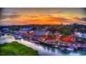 Breathtaking aerial view of waterfront restaurant at sunset with ample seating and scenic surroundings at 624 Blackberry Ave., Murrells Inlet, SC 29576