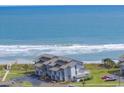 Aerial view of condo building nestled near the beach and ocean at 701 Norris Dr., Pawleys Island, SC 29585