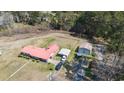 An aerial view of a property with a brick home, carport, and storage shed at 77 Towhee St., Georgetown, SC 29440