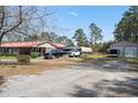 Spacious property with a brick home, carport, and storage shed at 77 Towhee St., Georgetown, SC 29440