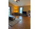 Comfortable living room featuring hardwood floors, neutral walls, and ample natural light at 1001 Leatherman Rd., Conway, SC 29527