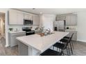 Bright kitchen featuring white countertops, stainless steel appliances, and an island at 4485 East Coast Ln., Shallotte, NC 28470