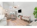 Bright living room with vaulted ceilings, a fireplace, and modern decor at 717 41St Ave. S, North Myrtle Beach, SC 29582