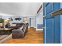 Comfortable living room showcasing hardwood floors, a leather sofa, and stylish decor at 1129 Palmetto St., Georgetown, SC 29440