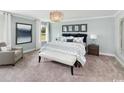 Relaxing main bedroom with a neutral palette, soft carpet, and comfortable furnishings at 2504 Watershed Way, Longs, SC 29568