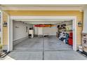 Spacious garage with ample storage and a kayak hanging from the ceiling at 343 Scottsdale Ct., Murrells Inlet, SC 29576