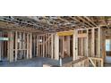 Interior framing showcasing a large open space with visible wiring, plumbing, and window placement at 37 Winnowing Way, Pawleys Island, SC 29585