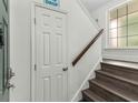 Bright entryway with a wooden staircase featuring a modern design and ample natural light at 4305 Lotus Ct. # G, Murrells Inlet, SC 29576