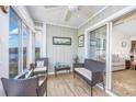 Cozy sun room leading to main living area with tranquil water views at 4616 Greenbriar Dr. # H8, Little River, SC 29566