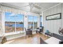 Relaxing sun room featuring comfortable seating and scenic views of the waterway at 4616 Greenbriar Dr. # H8, Little River, SC 29566