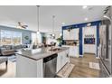 Bright kitchen with granite counters, stainless appliances, and open to the living area at 511 Mcalister Dr., Little River, SC 29566