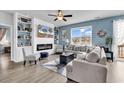 Cozy living room featuring a fireplace, built-in shelving, and ample natural light at 511 Mcalister Dr., Little River, SC 29566