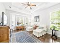 Bright sitting area featuring a bay window, comfortable chairs, and elegant decor at 728 Camden Circle, Pawleys Island, SC 29585