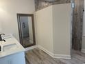 Bathroom featuring double sinks, framed mirror, and walk-in tiled shower at 870 Monterrosa Dr., Myrtle Beach, SC 29572