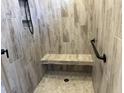 Detailed shot of a tiled shower featuring a built-in bench and modern fixtures at 870 Monterrosa Dr., Myrtle Beach, SC 29572