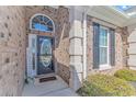 Inviting front entry with decorative door, sidelights, and a welcome mat at 169 Kessinger Dr., Surfside Beach, SC 29575