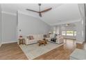 Bright living room featuring a comfortable sofa, area rug, and vaulted ceiling at 169 Kessinger Dr., Surfside Beach, SC 29575