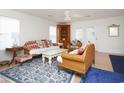 Cozy living room featuring wicker furniture, a ceiling fan, and lots of natural light at 319 16Th Ave. S, Surfside Beach, SC 29575