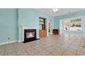 Open-concept living room with fireplace, built-in shelves, and views of the backyard at 329 Camden Circle, Pawleys Island, SC 29585